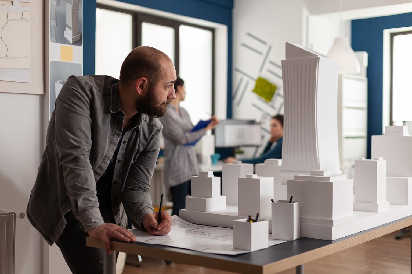 man-working-architectural-design-office